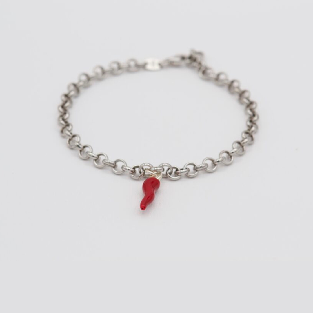 Silver bracelet with red horn