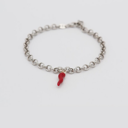 Silver bracelet with red horn