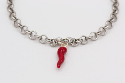 Silver bracelet with red horn