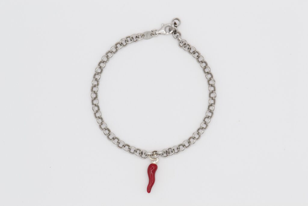 Silver bracelet with red horn